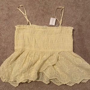 American Eagle slightly cropped top with floral print on the bottom.